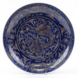 Large Chinese porcelain charger hand painted in blue with dragons chasing the flaming pearl