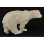 French Art Deco polar bear having a cream glaze stamped Made in France to the base, 26.5cm in length