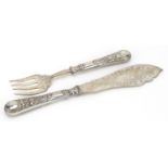 Pair of Victorian silver fish servers, the blades engraved with vines, S S maker's mark London 1883,