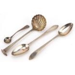 Four Georgian and later silver spoons including a George III sifting spoon, the largest 17.5cm in