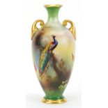 Royal Worcester porcelain twin handled vase hand painted with a peacock, numbered 287, 11.5cm high :