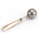 French 19th century silver babies rattle with carved mother of pearl handle, the bell engraved