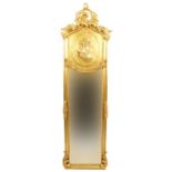 Large ornate gilt framed wall mirror with bevelled glass and relief panel of a maiden, 180cm x