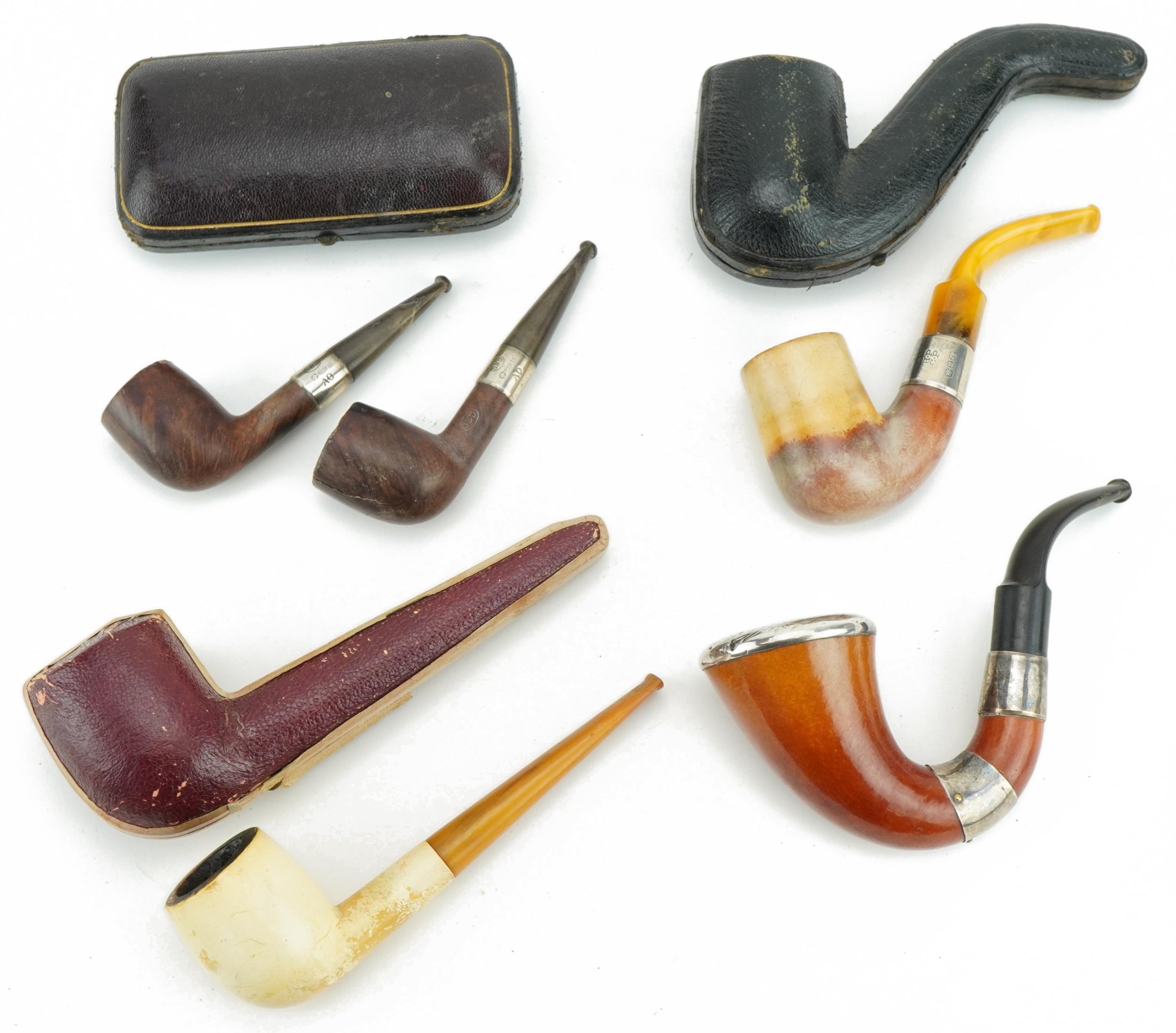 Victorian smoking pipes, four with silver mounts including a pair by G B D housed in a fitted tooled