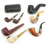 Victorian smoking pipes, four with silver mounts including a pair by G B D housed in a fitted tooled