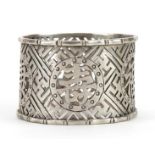 Circular Chinese silver napkin ring pierced and engraved with character marks, 4.5cm in diameter,