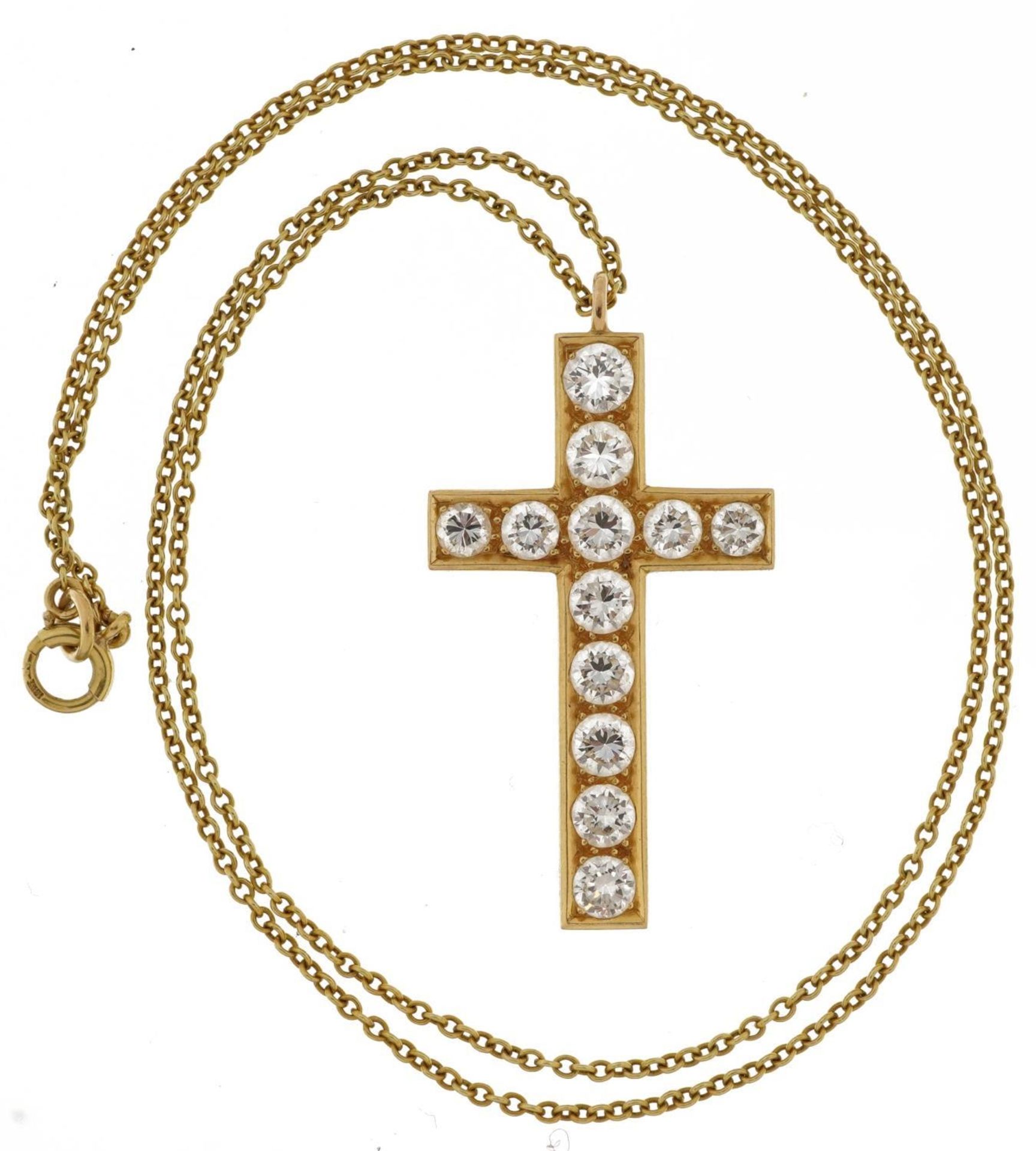 Unmarked gold cross pendant set with twelve diamonds of varying sizes, the largest diamond - Image 2 of 4