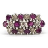 18ct white gold diamond and ruby three row cluster ring, the largest diamond and ruby each