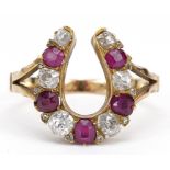 19th century unmarked gold diamond and ruby horseshoe ring, tests as 18ct gold, the largest