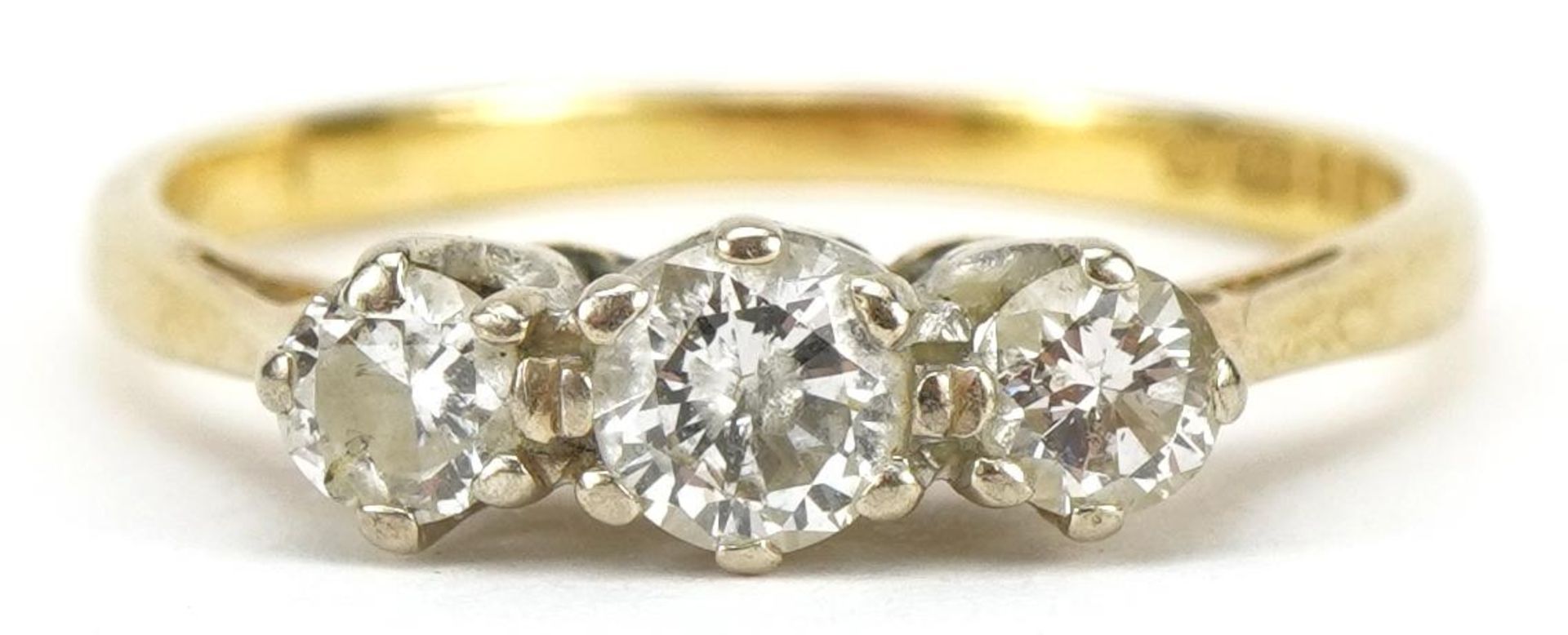 18ct gold diamond three stone ring, the largest diamond approximately 0.18 carat, size M/N, 2.4g :