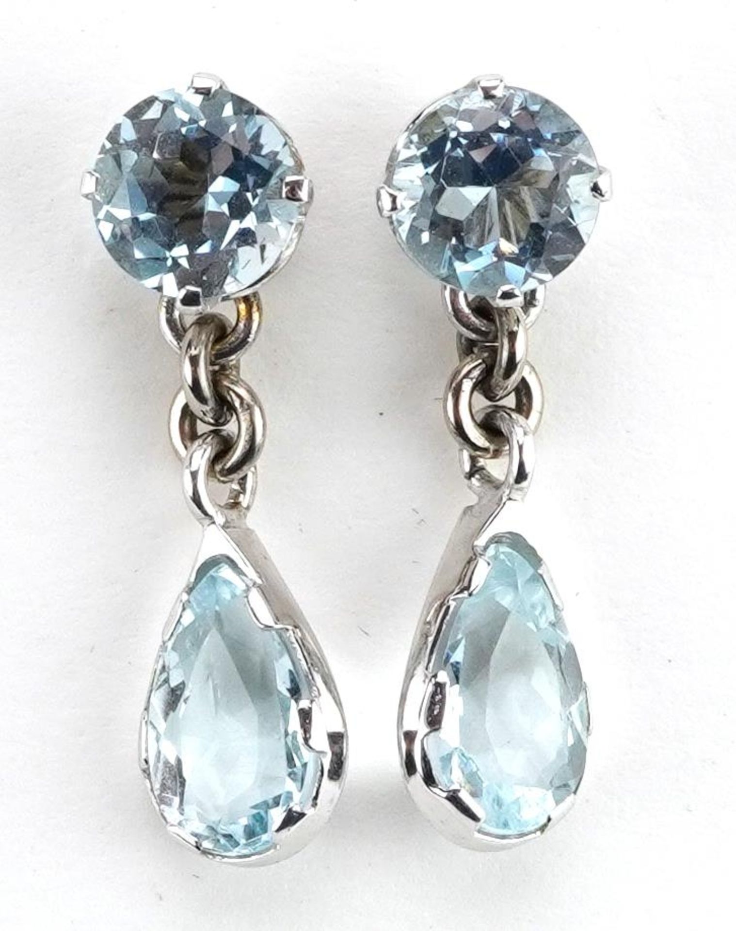 Pair of unmarked white gold aquamarine teardrop earrings, the butterflies marked 14k, 2.4cm high,