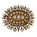 Large Victorian unmarked gold cultured pearl and diamond starburst brooch, tests as 18ct gold, 4.5cm