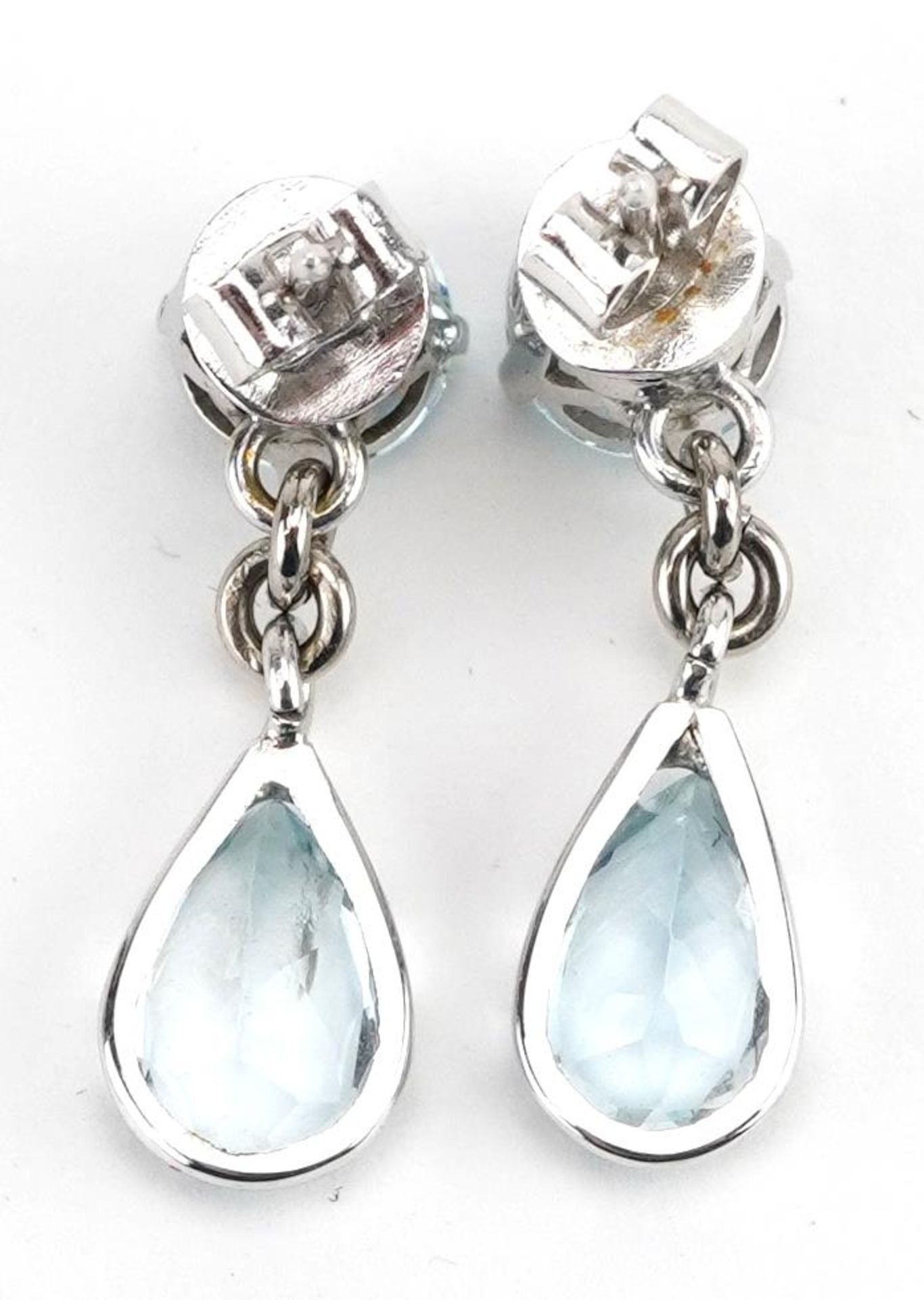 Pair of unmarked white gold aquamarine teardrop earrings, the butterflies marked 14k, 2.4cm high, - Image 2 of 2