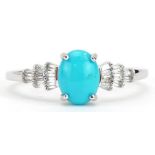 9k white gold turquoise cluster solitaire ring with baguette cut diamond shoulders, the turquoise