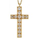 Unmarked gold cross pendant set with twelve diamonds of varying sizes, the largest diamond