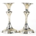 Pair of Arts & Crafts silver tulip candlesticks, indistinct maker's mark Chester 1907, 16.5cm