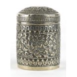 Anglo Indian unmarked silver cylindrical box and cover embossed with flowers and vines, 7.5cm