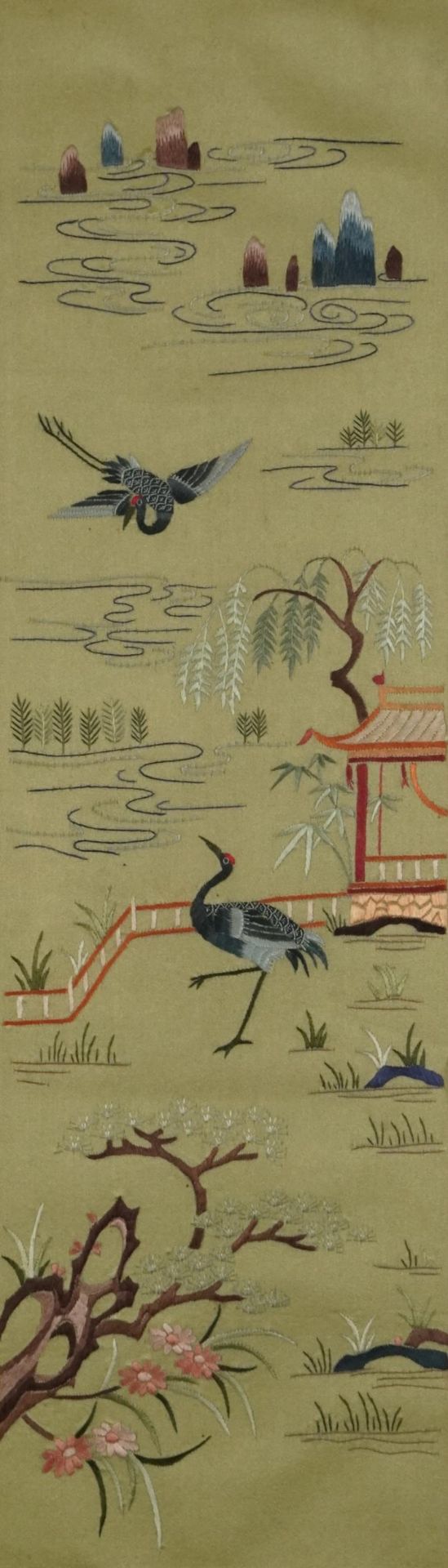 Flowers, pagodas and cranes, Chinese silk embroidery, mounted, framed and glazed, 51cm x 15cm