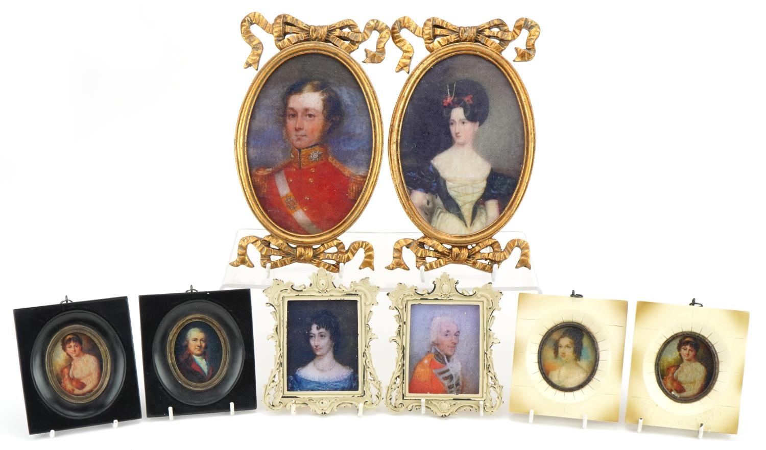 Four pairs of portrait miniatures including gentleman wearing military dress, the largest overall