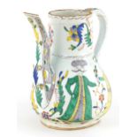 Turkish Ottoman Kutahya pottery water jug hand painted with figures and stylised flowers, 19cm high
