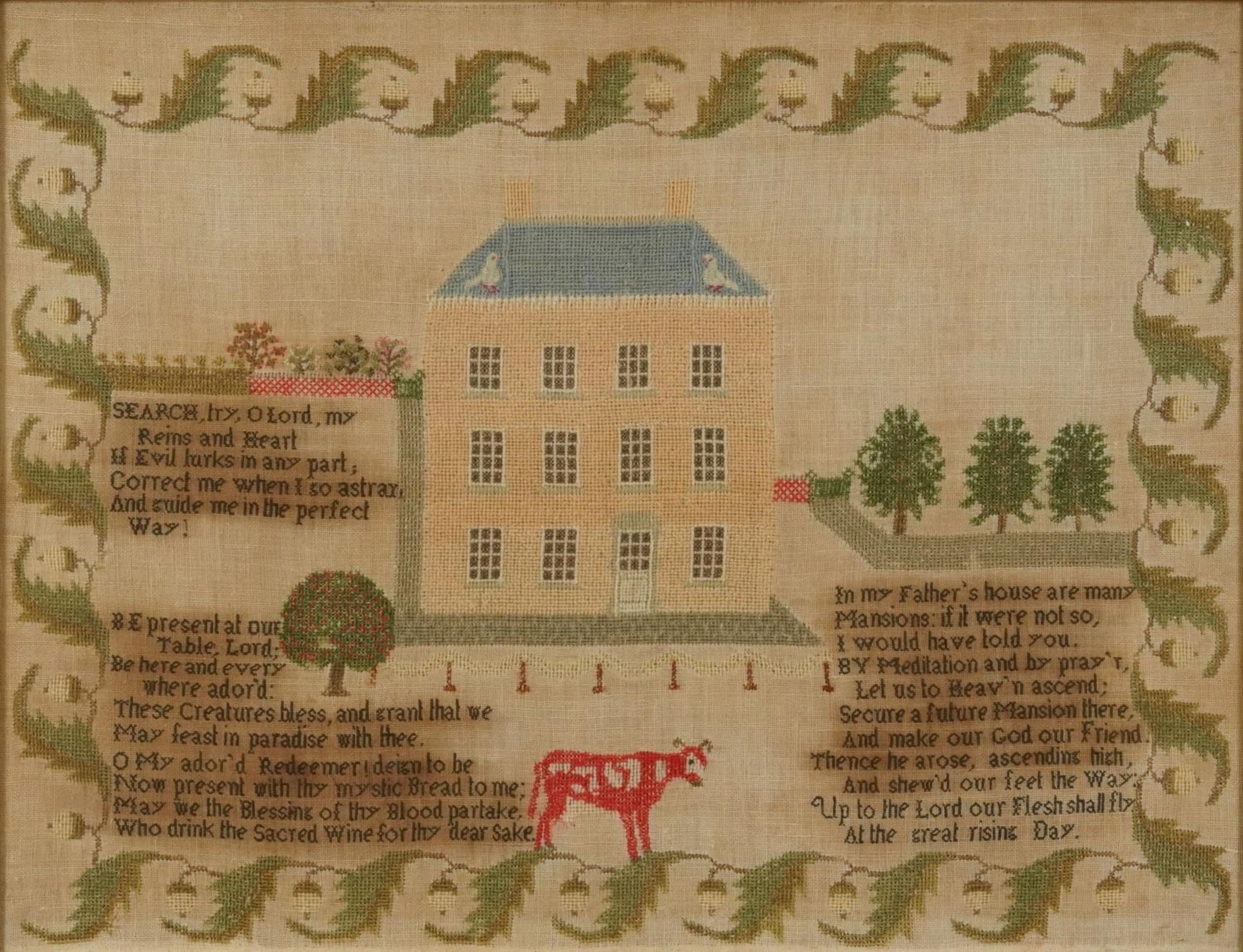 19th century needlework sampler embroidered with a house, acorns and religious verse, mounted,