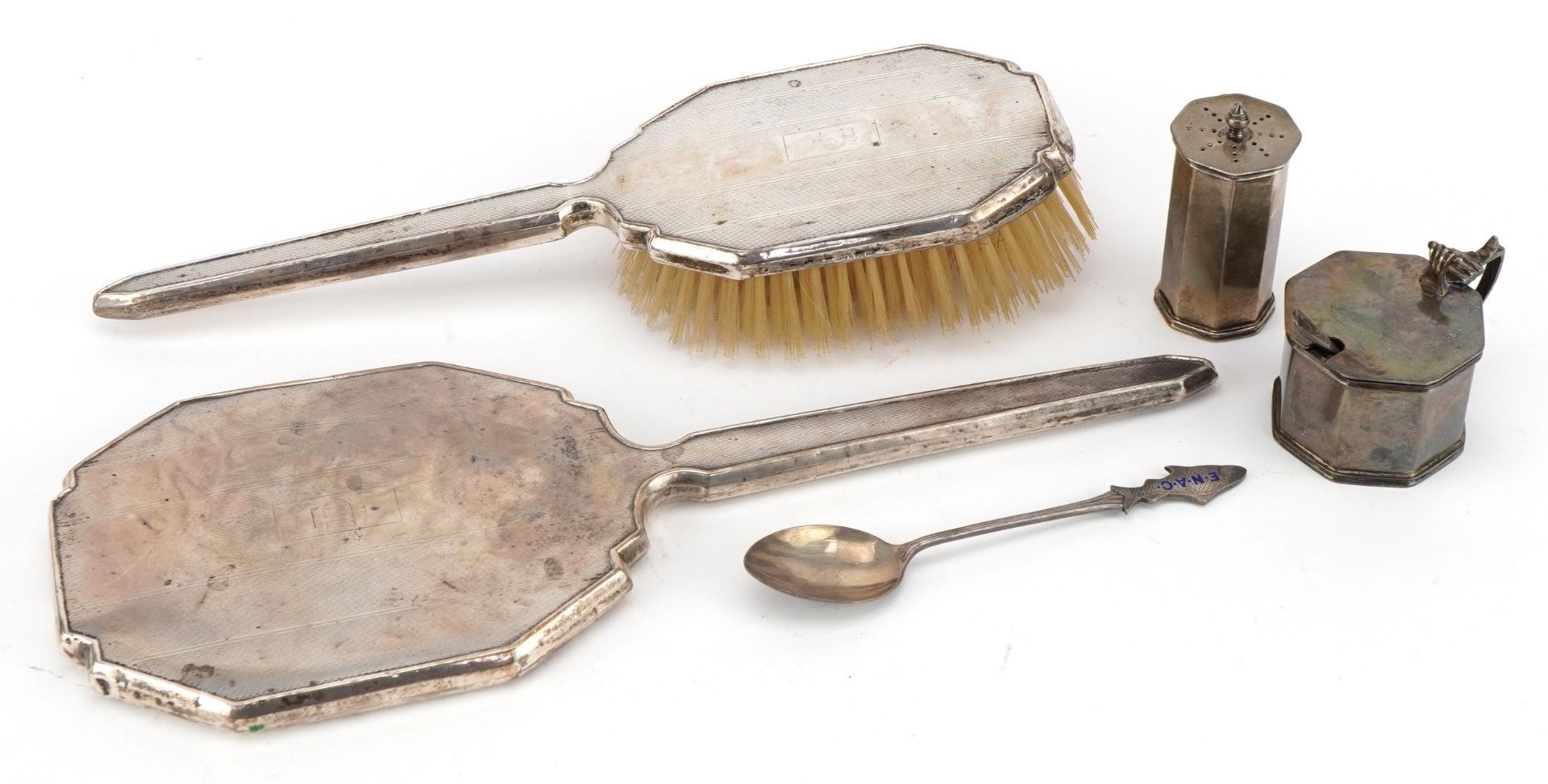 Art Deco silver comprising hand mirror, brush, mustard and caster together with a silver and