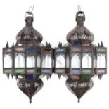 Pair of Moroccan bronzed hanging lanterns with coloured glass panels, 50cm high