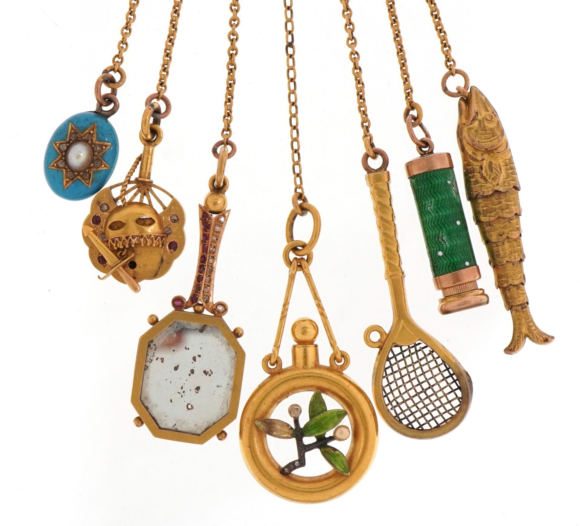 Antique 22ct gold chatelaine with six gold implements and pendants and a yellow metal articulated