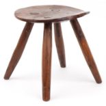 Farmhouse style yew wood four footed stool, 28cm high x 27.5cm in diameter