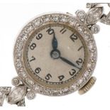 Art Deco ladies platinum and diamond cocktail watch, the 14ct white gold strap set with twenty eight