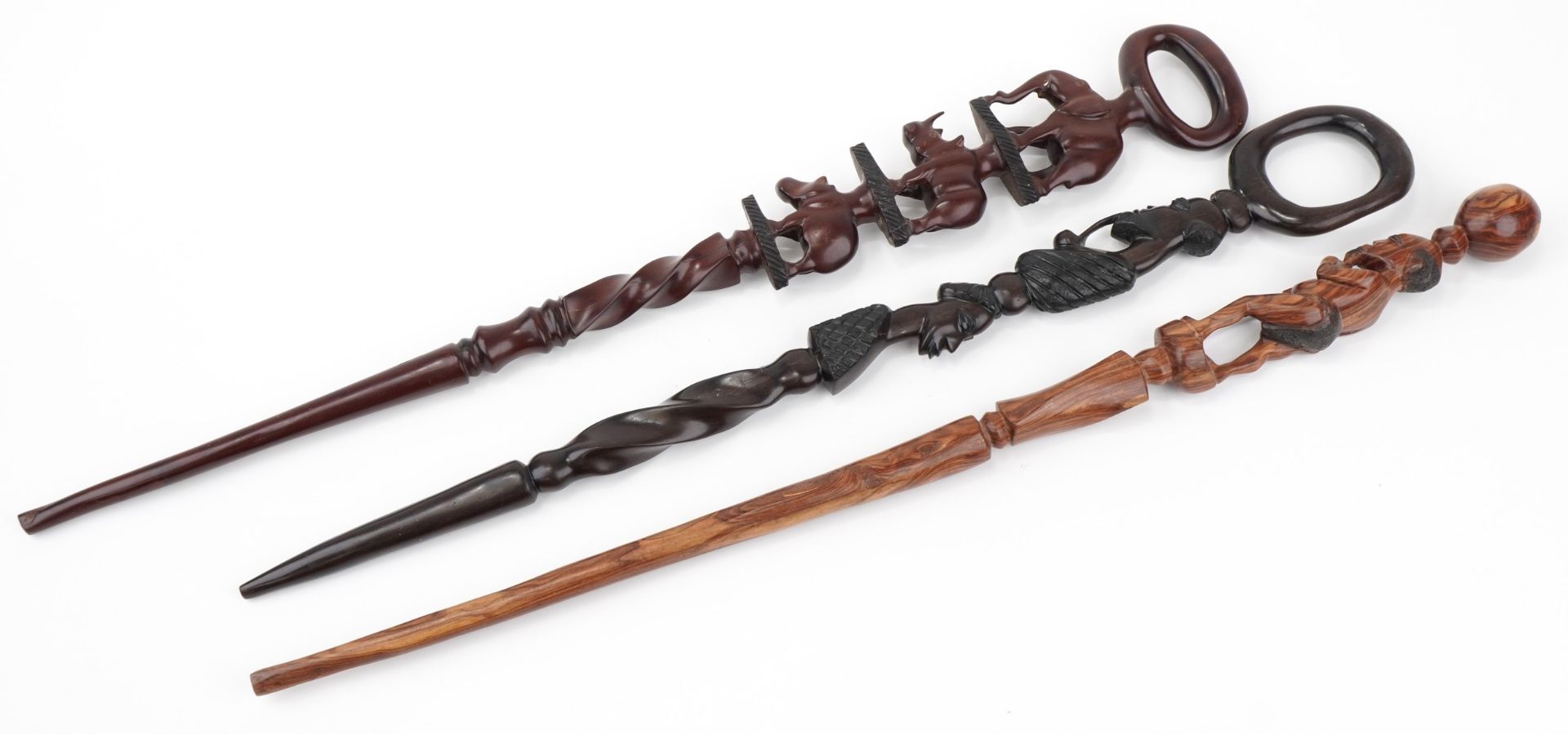 Three African hardwood walking sticks including two carved with figures, the largest 104cm in length - Image 2 of 3