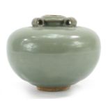 Chinese porcelain three handled jar having a celadon glaze, 10cm high