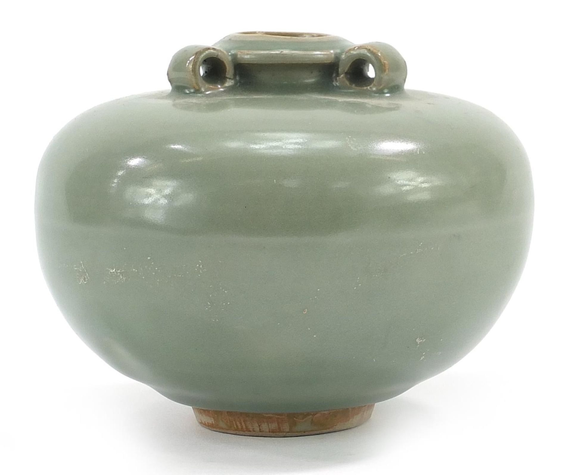 Chinese porcelain three handled jar having a celadon glaze, 10cm high