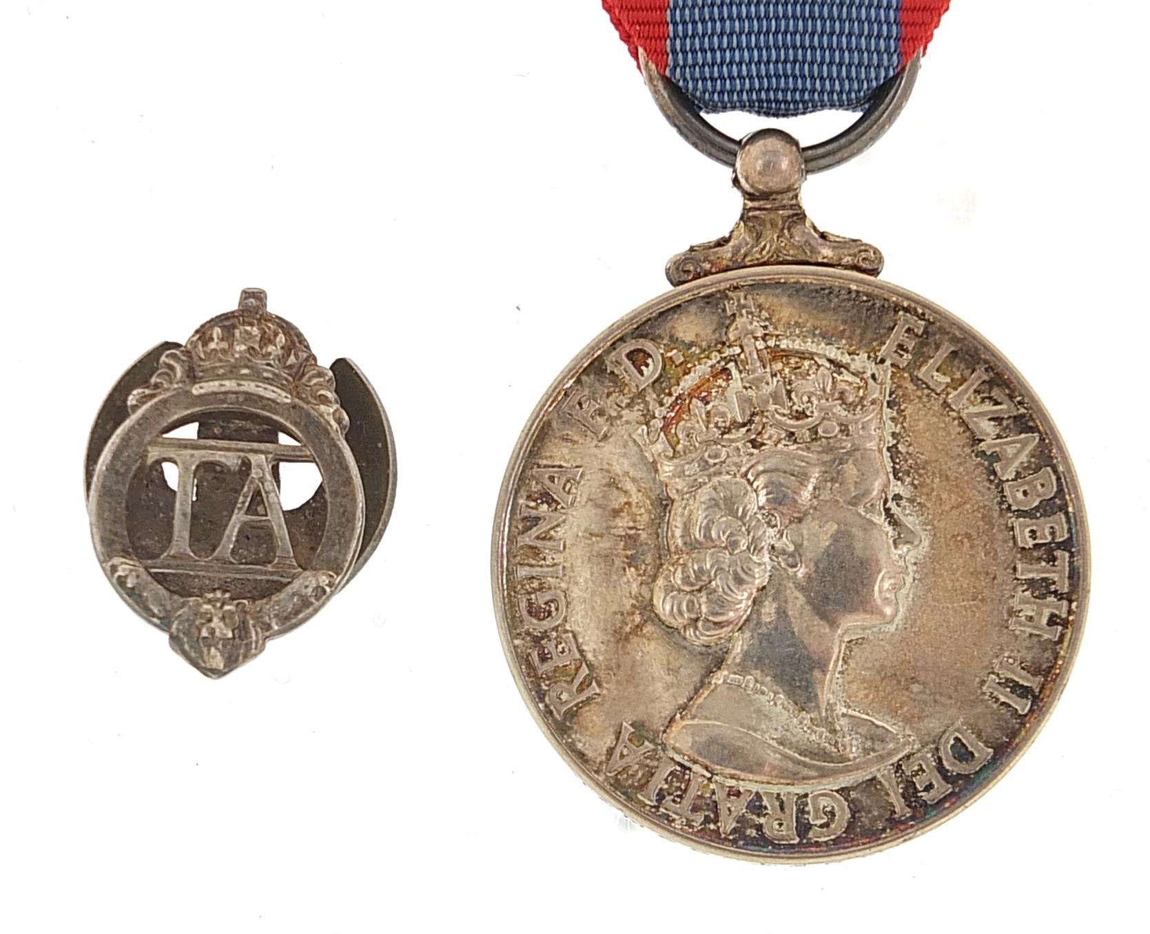 Military interest Elizabeth II Faithful Service medal and TA lapel, the Faithful Service medal