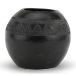 Native American pottery vase incised with a geometric design, inscribed D Sibiya to the base, 12cm