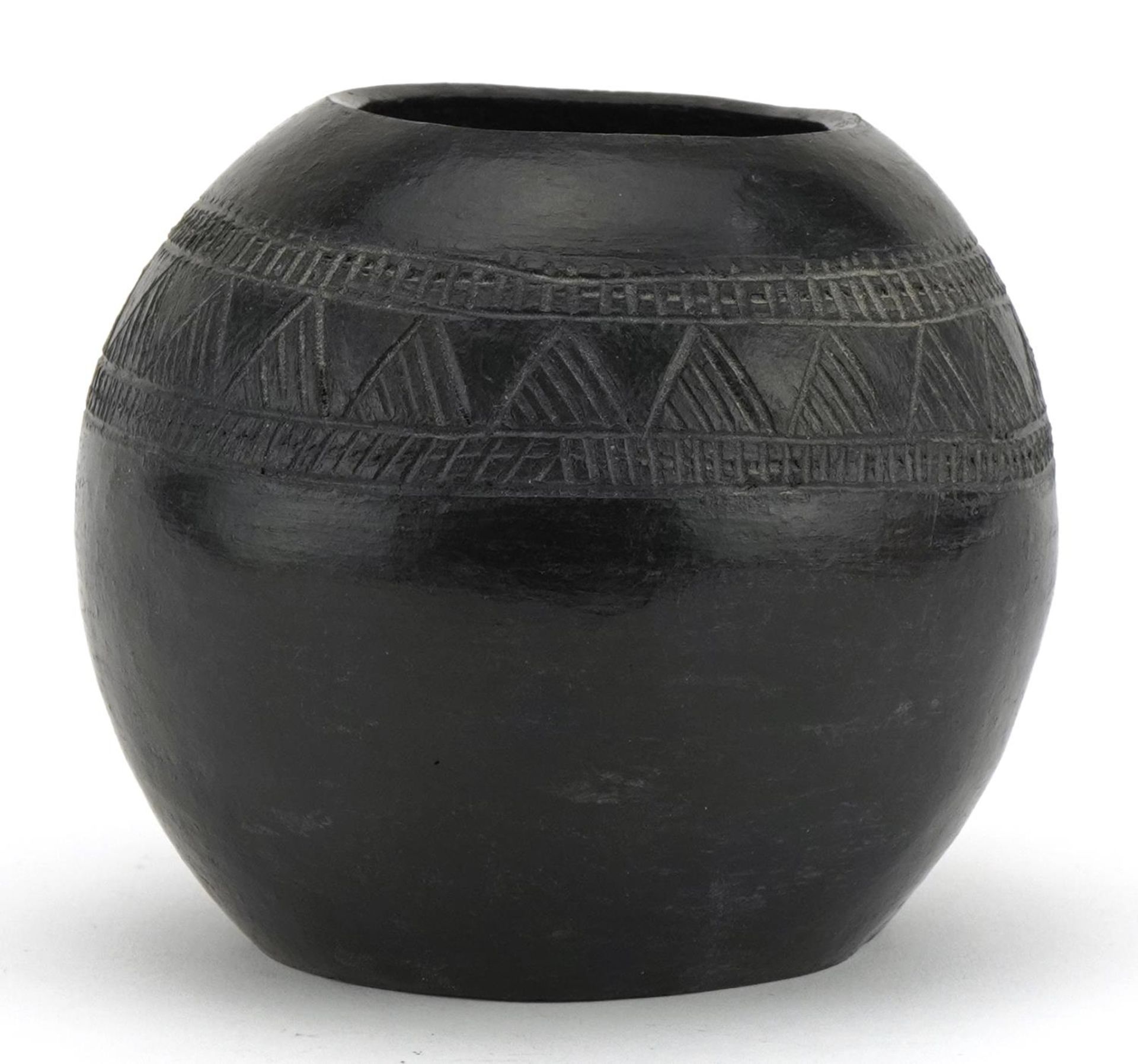 Native American pottery vase incised with a geometric design, inscribed D Sibiya to the base, 12cm