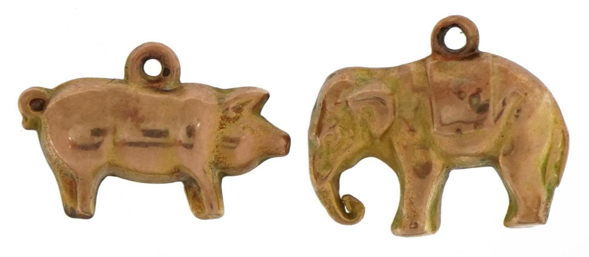 Two 9ct gold animal charms comprising pig and elephant, the largest 1.8cm wide, total 1.6g