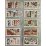 Collection of cigarette cards arranged in two folders