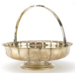 Holland, Aldwinckle & Slater, Edward VII heavy silver fruit bowl with swing handle, London 1908,