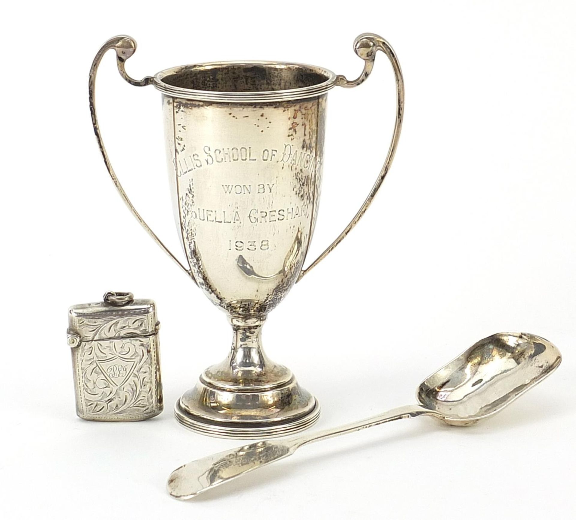 Victorian and later silver objects comprising preserve spoon, trophy with twin handles and vesta,