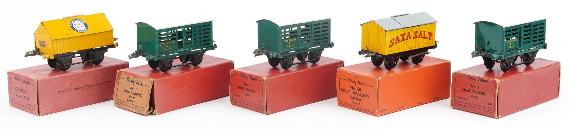 Five Hornby O gauge tinplate model railway wagons and vans with boxes comprising No 1 Milk Traffic