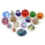 Glass paperweights including millefiori, double love heart and Caithness examples, the largest 9.5cm