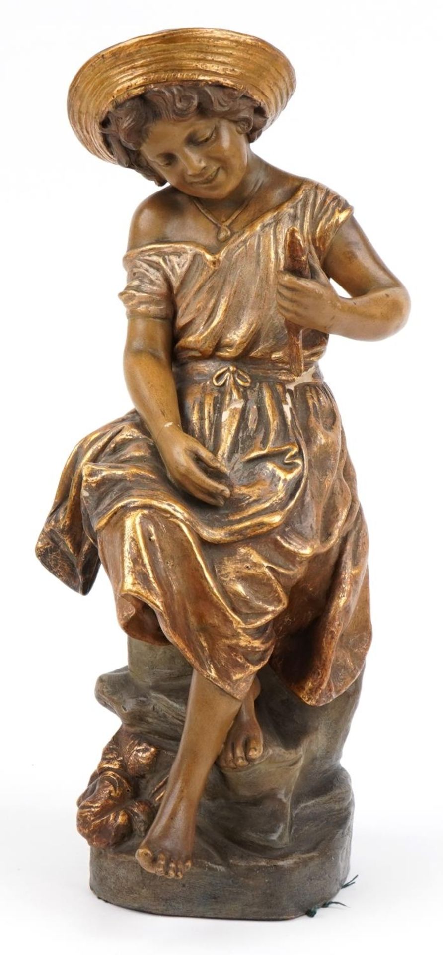 Goldschneider, Austrian partially gilt terracotta figure of a young female holding a fish, signed