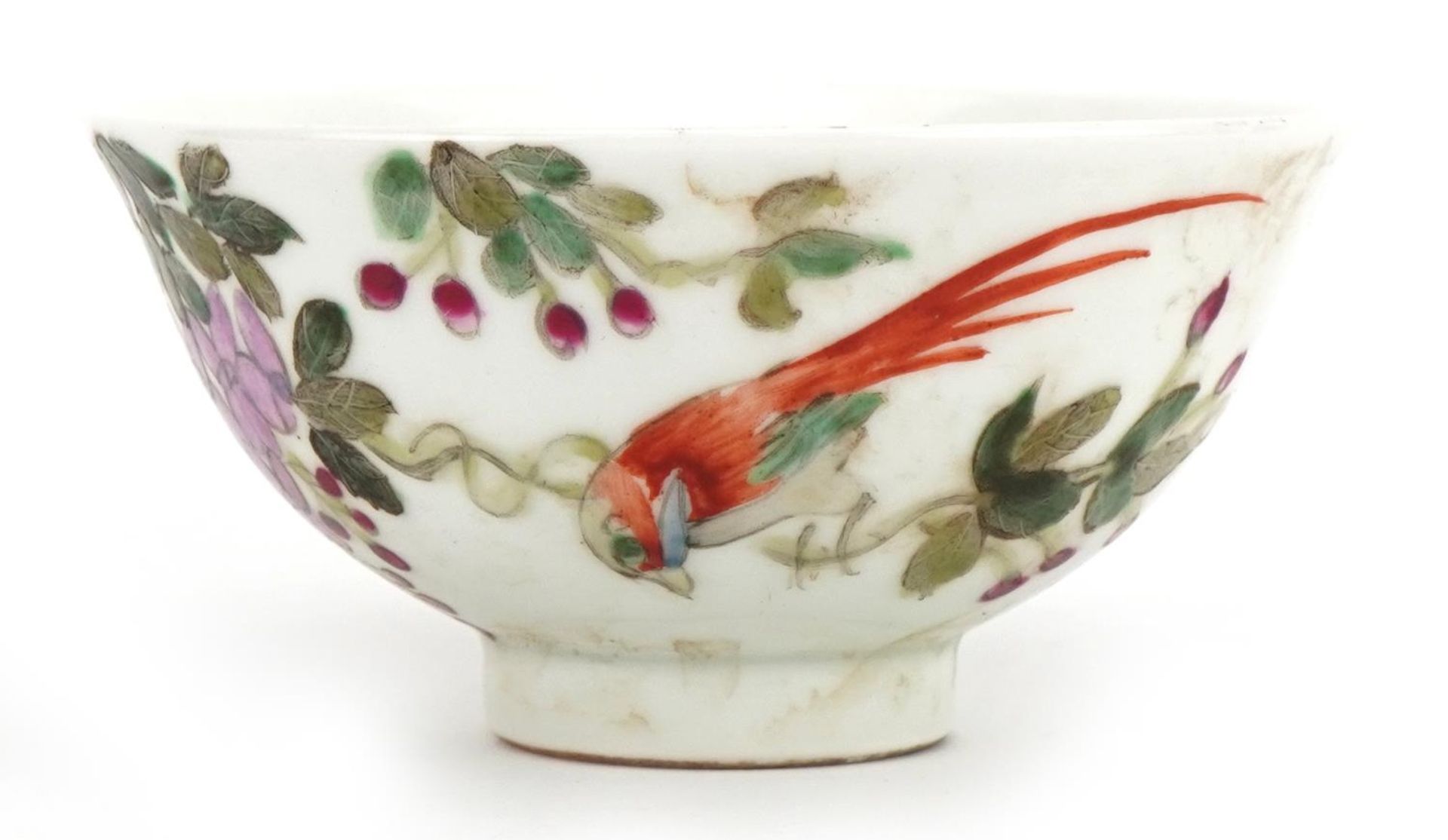 Chinese porcelain bowl hand painted in the famille rose palette with a bird amongst flowers and