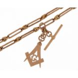 9ct rose gold watch chain with masonic charm, T bar and dog clips, 38cm in length, 32.3g