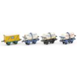 Four Hornby O gauge tinplate model railway advertising wagons comprising Nestle Milk, United Dairies