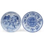 Pair of Chinese blue and white porcelain chargers decorated with figures in a palace setting and
