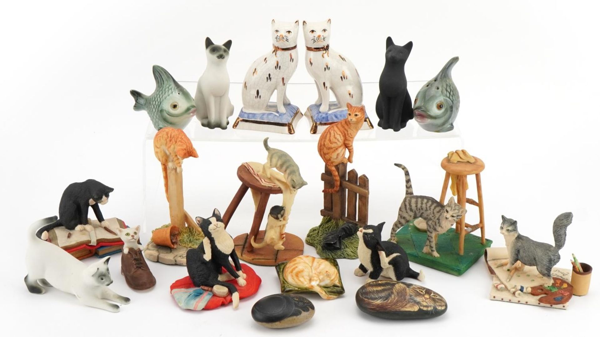 Collection of porcelain and resin model cats and fish including a pair of Staffordshire Ware