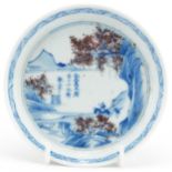 Chinese blue and white with iron red porcelain dish hand painted with a figure on horseback before a