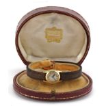 Cartier, early 20th century ladies gold Cartier wristwatch with leather strap and 18ct gold strap